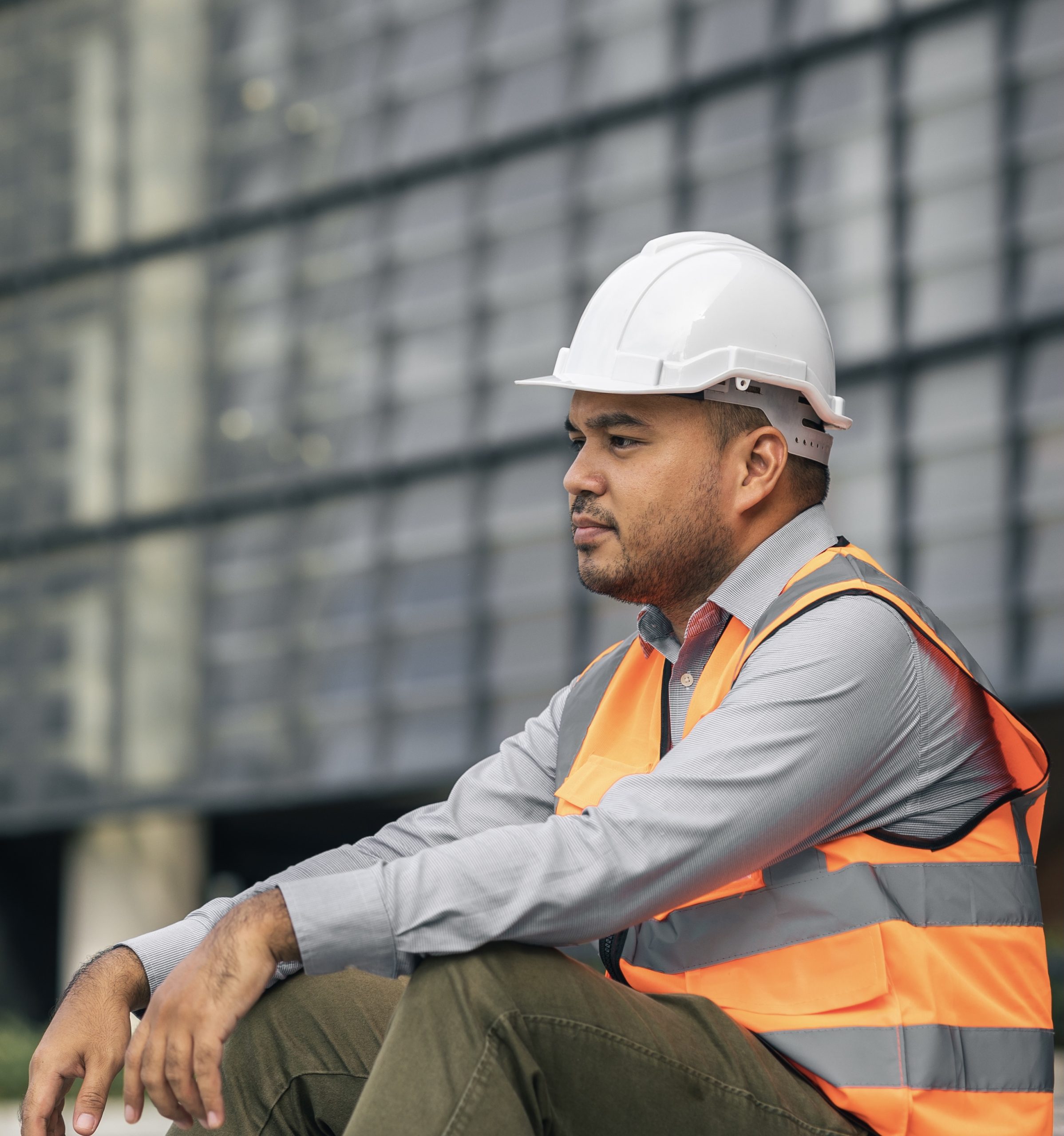 Worker hard working at construction site he tired and disconsolate. The civil engineer made a mistake, he was very stressed. Damage the structure of the building causing a breakdown.
